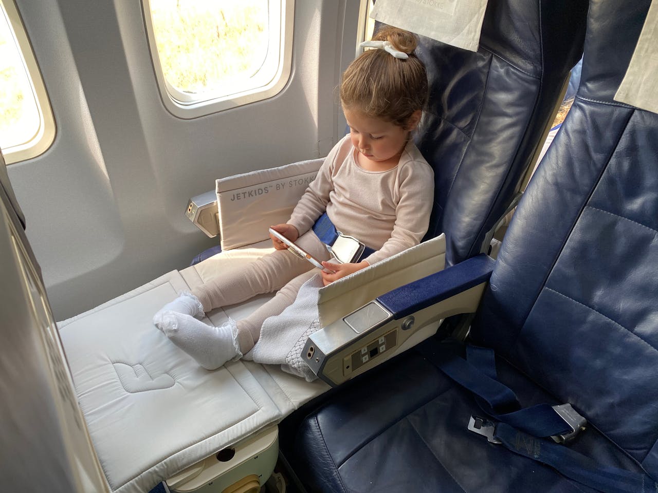 girl sitting inside an airplane
