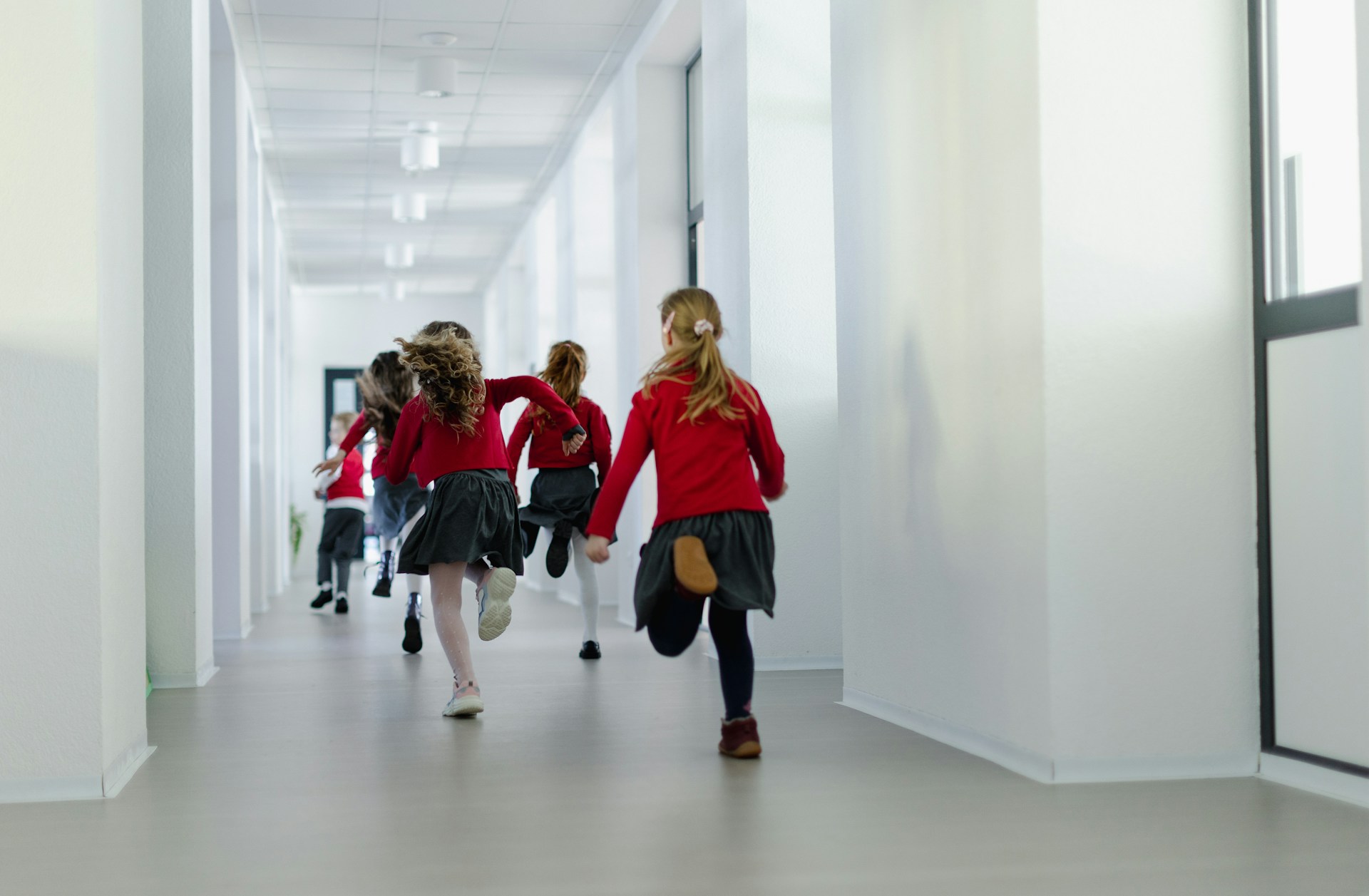 A group of young girls in a private school wearing private school uniforms, representing private school and child support payments in Ontario.